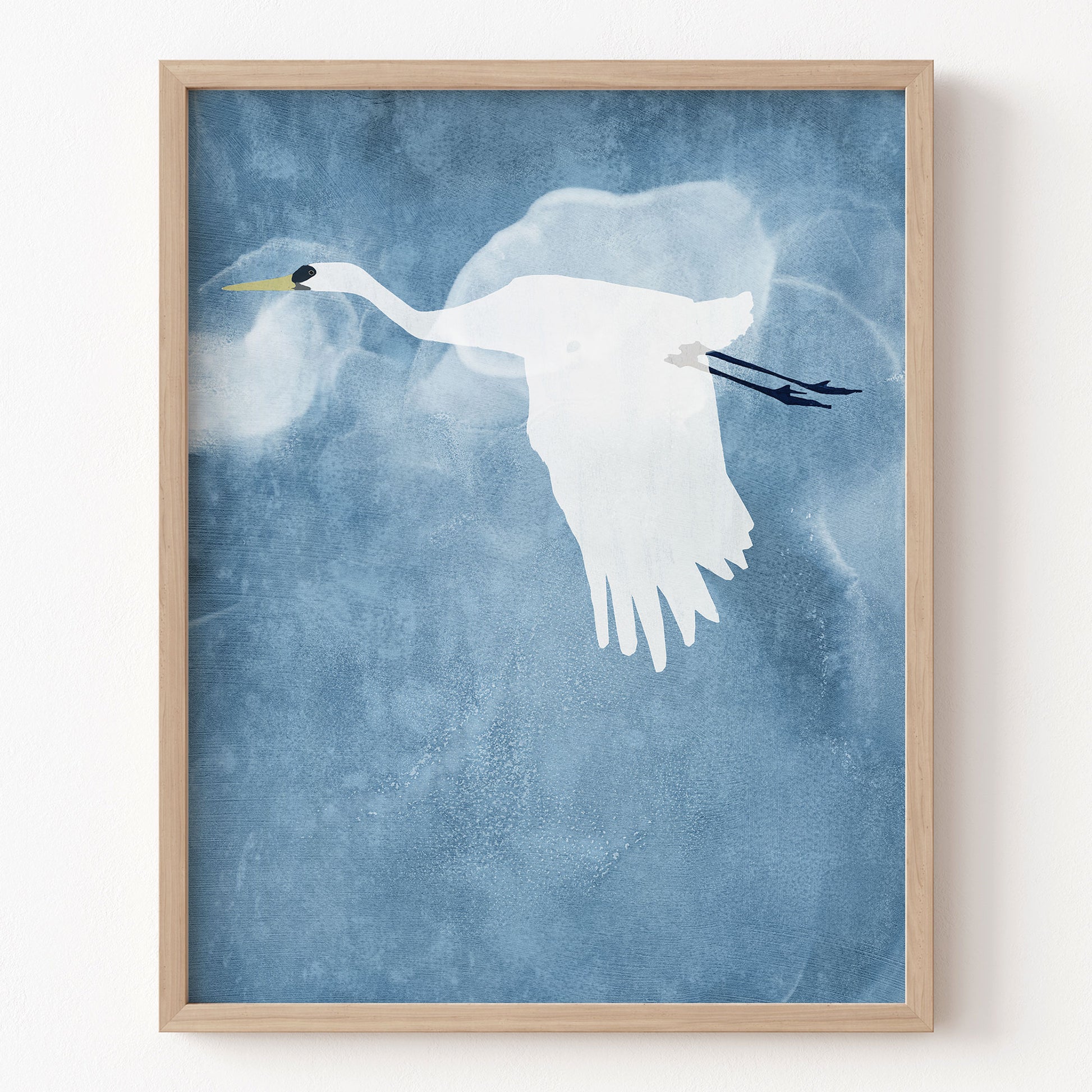 Framed artwork of a white bird on a blue textured background
