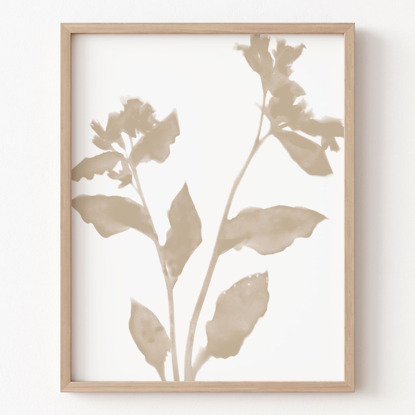 Framed botanical art print with beige leaves on a white background