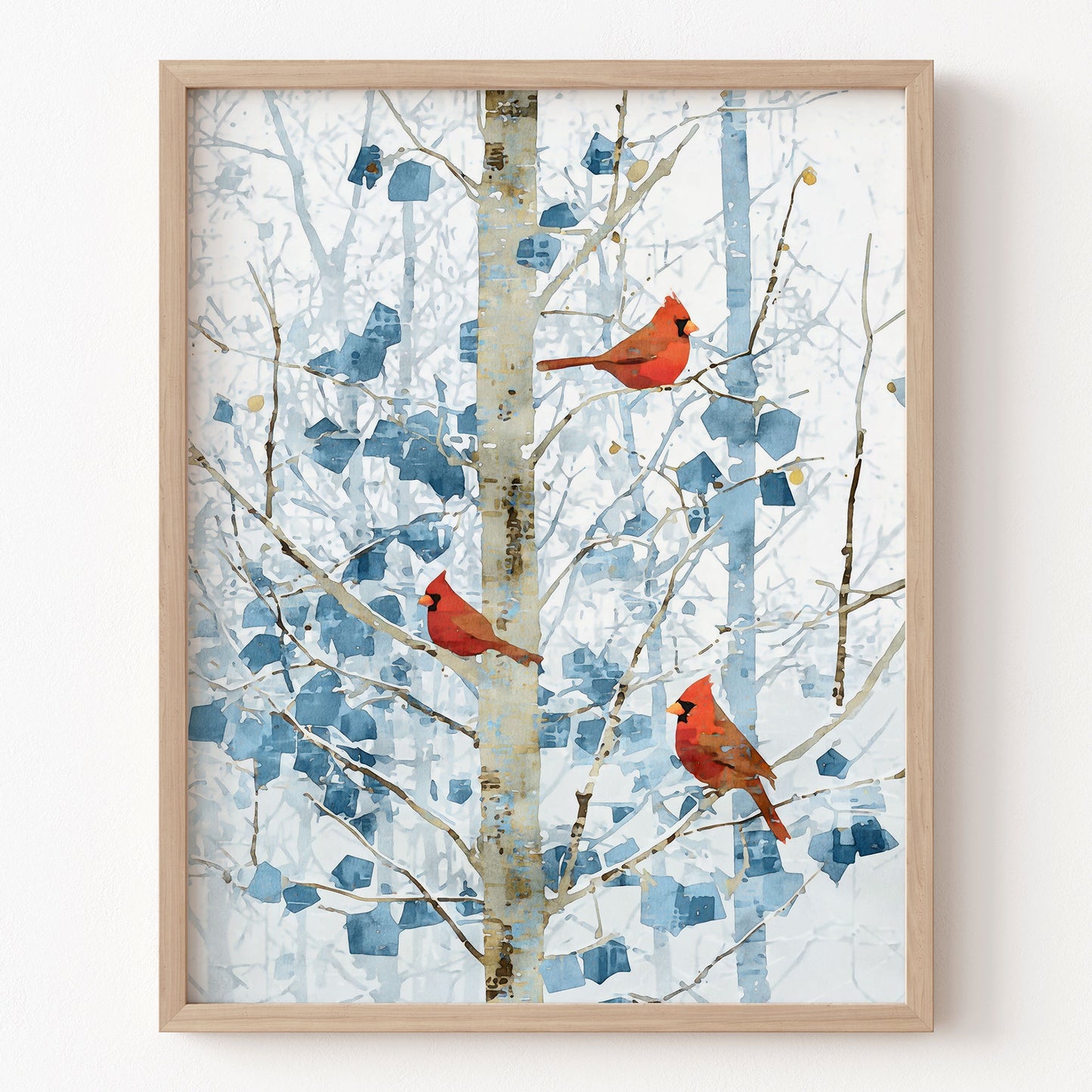 Framed artwork of cardinals on branches with a blue abstract pattern