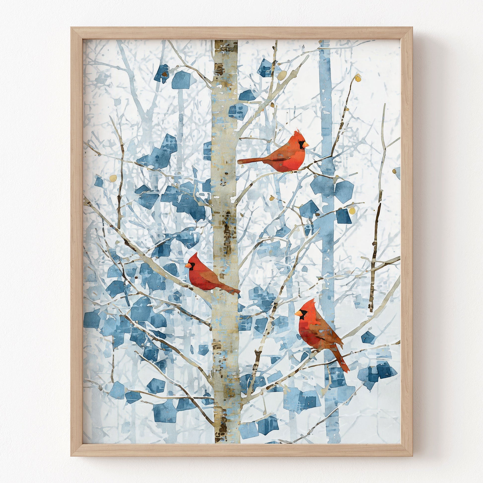 Framed artwork of cardinals on branches with a blue abstract pattern