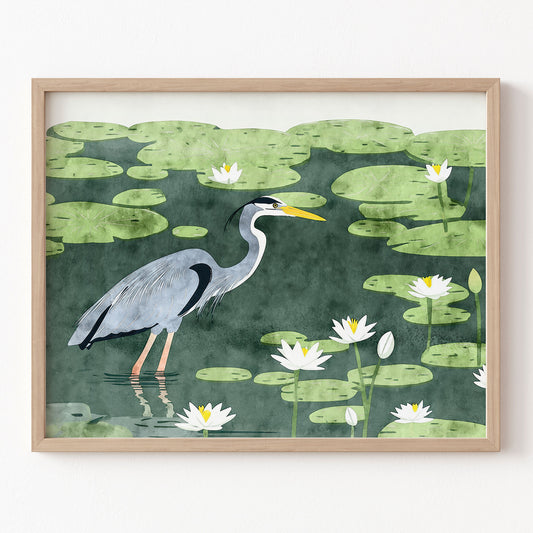 Framed artwork of a heron in a pond with lily pads and water lilies.
