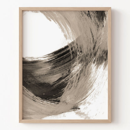 Abstract art print in a wooden frame on a white wall