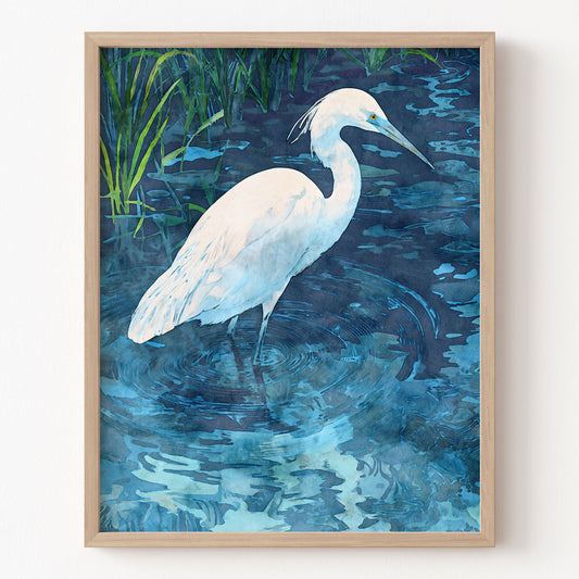 Framed artwork of a white egret in water with a natural background