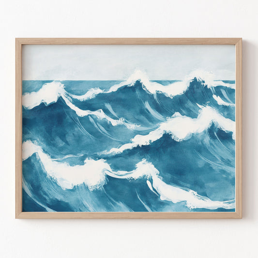 Framed artwork of blue ocean waves on a white wall