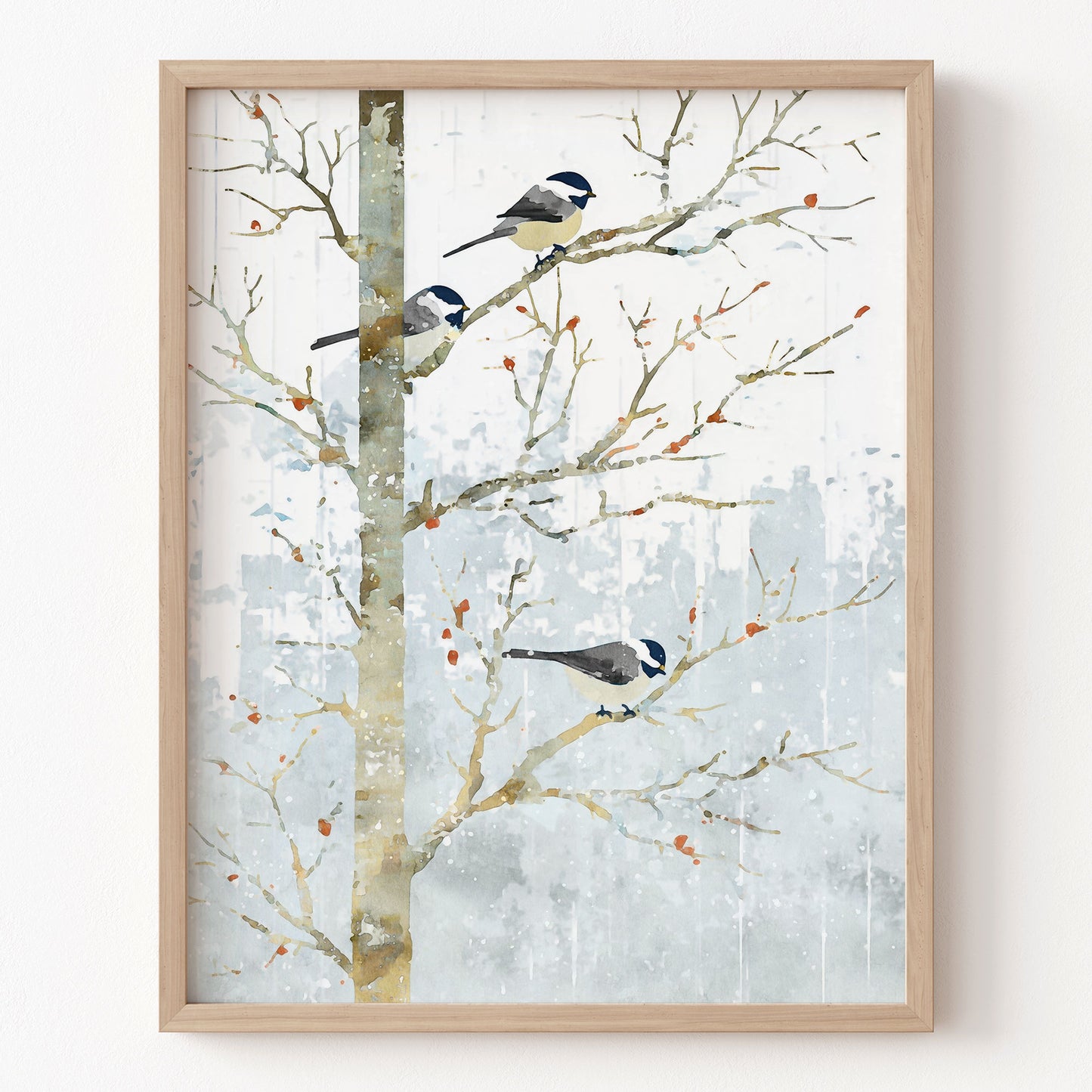 Framed artwork of birds on branches with a snowy background