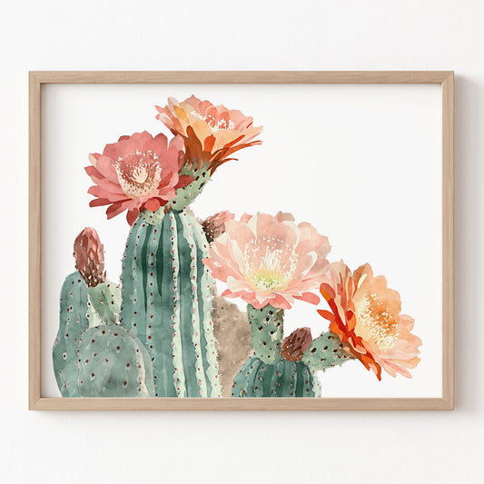 Framed artwork of a cactus with pink flowers on a white background