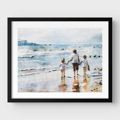 Framed watercolor painting of a woman and two children walking along the shoreline, mounted on a white wall with a black frame.