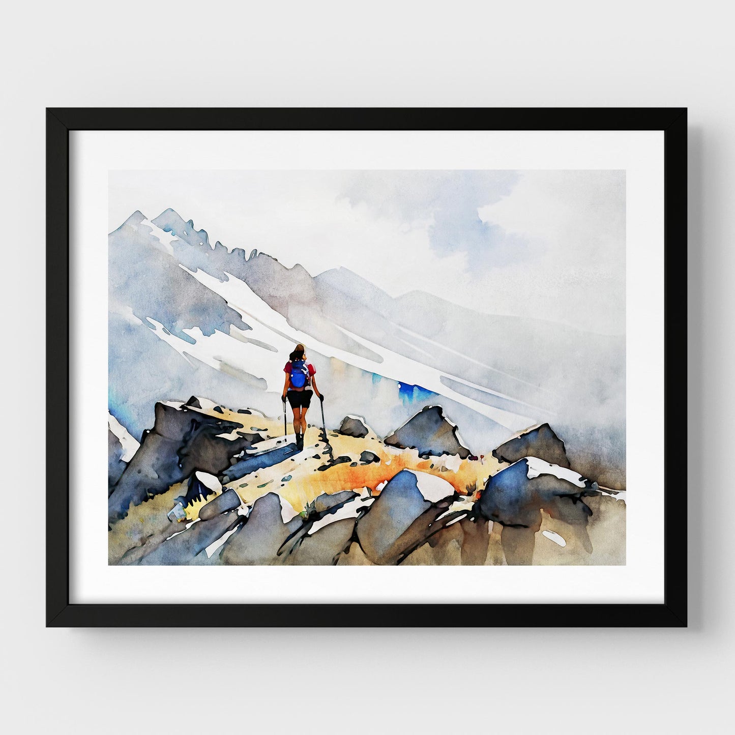 A black framed artwork of a hiker with trekking poles and a blue backpack on a rocky mountain path.