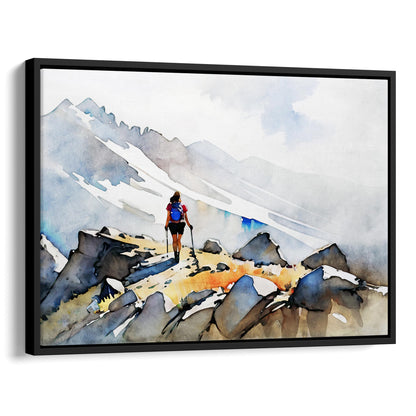 Black framed canvas print of a hiker with trekking poles and a blue backpack on a rocky mountain path, with misty snow-covered peaks in the background.