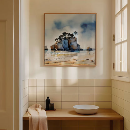 Minimalist bathroom with beige tiles, a wooden countertop with a round white basin, and a framed watercolor painting of a coastal rock formation on the wall.