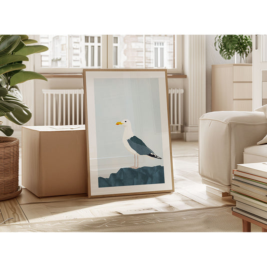 Framed illustration of a seagull on a dark blue rock, leaning against an ottoman in a sunlit living room with neutral decor.