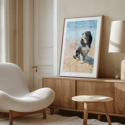 Living room with a white armchair, wooden cabinet, and framed picture of a dog on a beach.