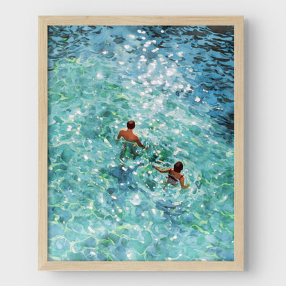 Couple Swimming in Sunlit Sea Art Print