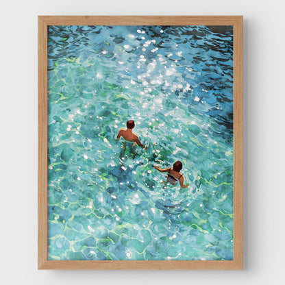 Couple Swimming in Sunlit Sea Art Print
