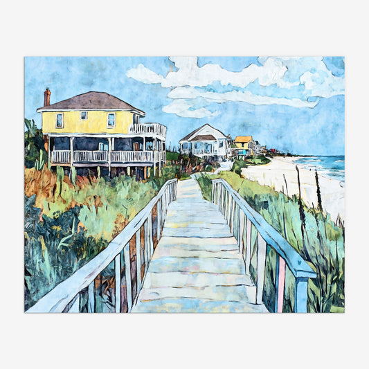 Watercolor-style painting of a coastal boardwalk leading past colorful beach houses, with a prominent yellow home on stilts to the left. The path winds through tall dune grass toward a white sandy beach and ocean waves under a blue sky with scattered clouds.