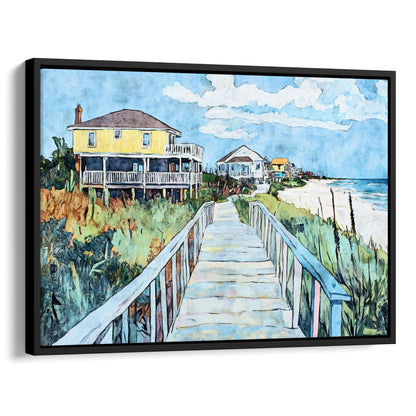 Black framed canvas print featuring a watercolor-style boardwalk scene leading to the ocean, with a bright yellow beach house on the left, coastal grasses along the walkway, and vivid blue sky and sea in the background.