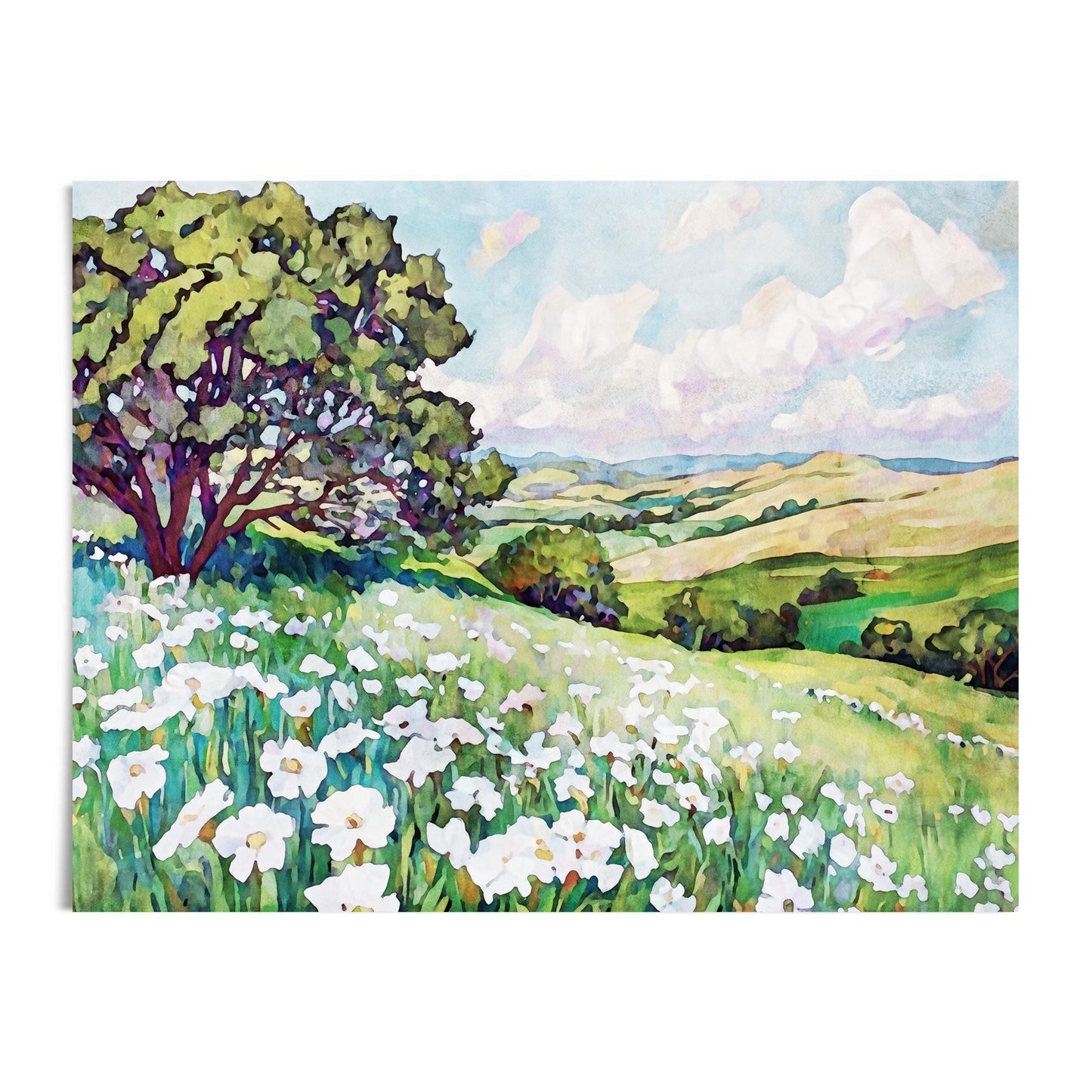 Watercolor painting of a bright meadow filled with white wildflowers, a large leafy tree on the left, and rolling green hills stretching into the distance under a blue sky with fluffy white clouds.