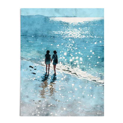 Watercolor-style art print of two women walking hand in hand along a sunlit shoreline, surrounded by shimmering waves and soft reflections in shades of blue. Set against a white background for a clean, modern presentation.